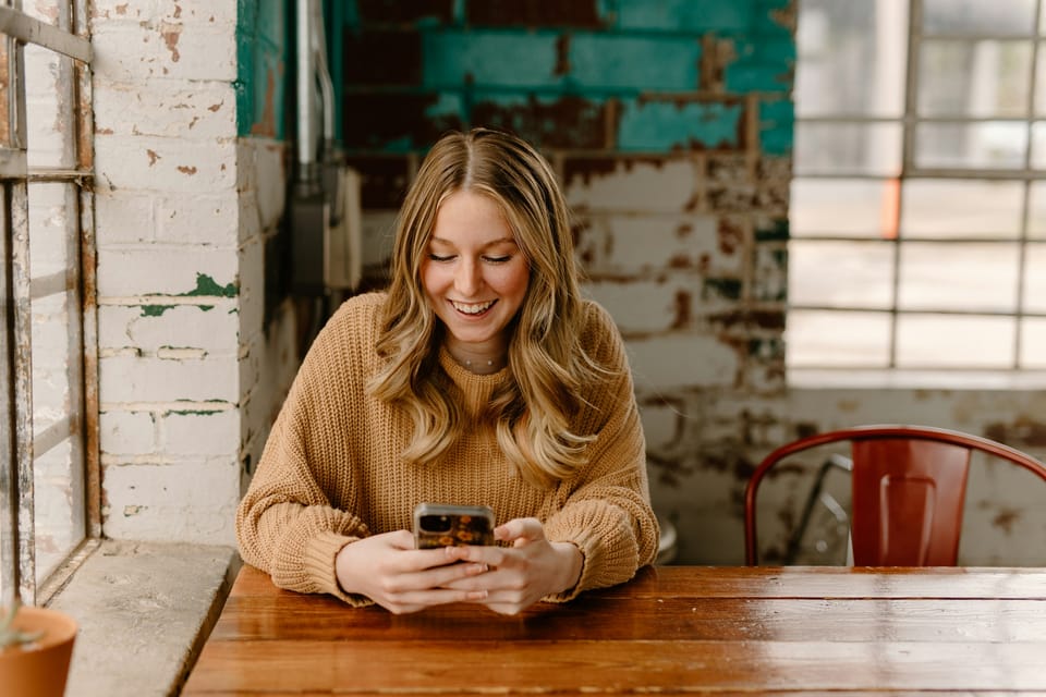 Person chatting with KiwiBooks on their phone